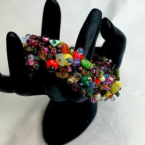 Boho beaded Bracelet. Multicolored beads with bead and loop closure